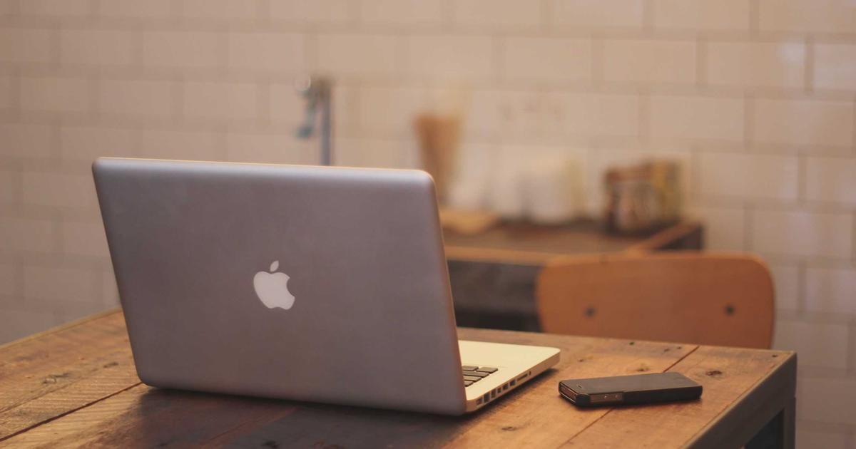 Adult person working at a desk with focus
